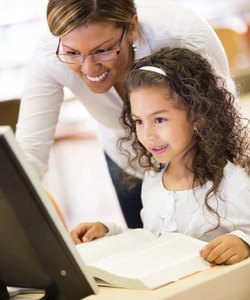 Girl learning to use technology
