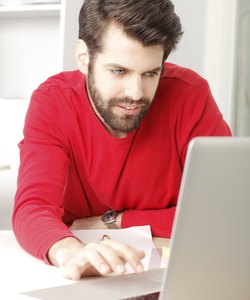 Young businessman working in architect studio