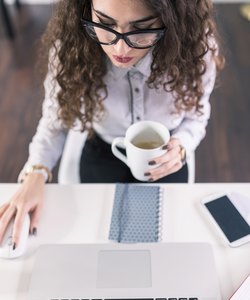 Advertising Account Executive working on her laptop in her offic