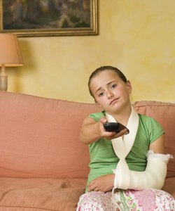 Bored girl in arm cast