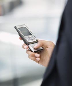 Hand holding cell phone
