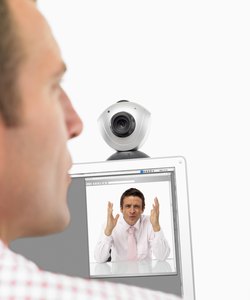 Businessmen communicating on webcam