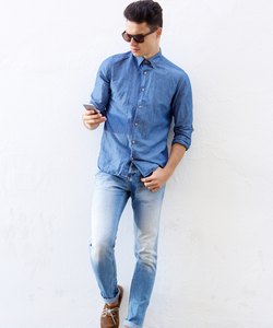 Cool hipster guy reading mobile phone message