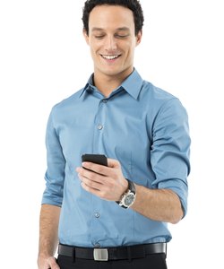Businessman Texting On Cell Phone