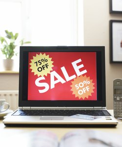 Sale advertisment on screen of laptop