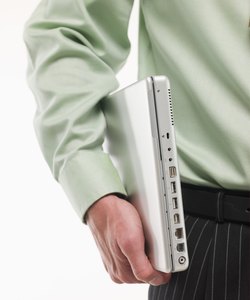 Man carrying laptop under arm