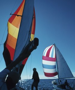 People on sailboats in ocean