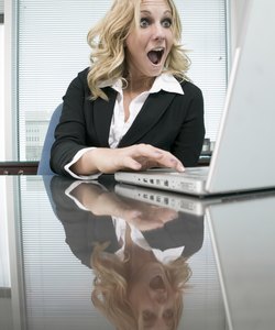 Woman at desk using computer