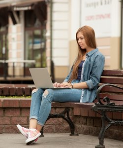 Young stylish woman with a laptop.