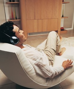 Man Relaxing to Music in His Sitting Room