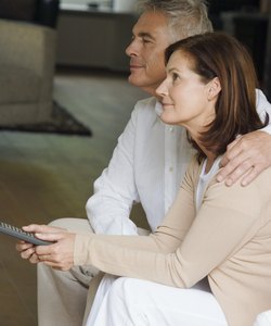 Couple watching television together