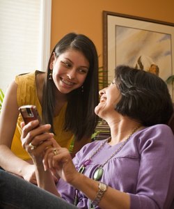 mother and daughter with cell phone