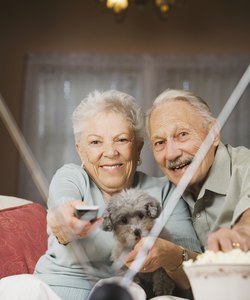 Senior couple watching television