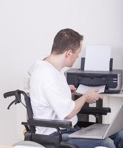 disabled man in wheelchair at work