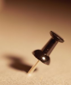 Push pin in bulletin board, close-up