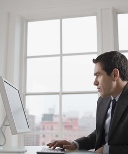 Businessman sitting at desk with computer