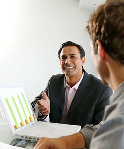 Man making presentation to colleague