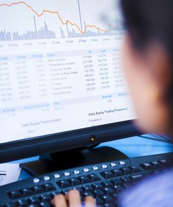 Broker examining stock drop