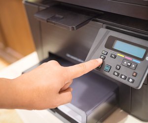 Copier Start, Finger pressing the start button on multifunction printer or copier