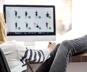 Female photo editor working on computer