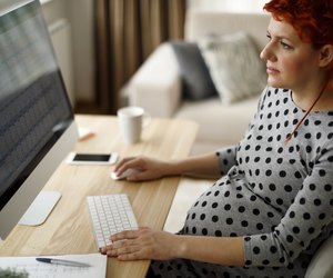 Pregnant woman working from home office