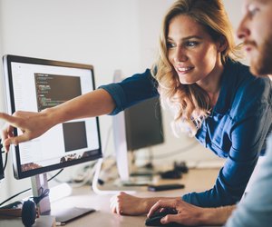 Software engineers working on project and programming in company