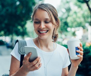 Smiling Young Woman Having Video Call Outdoors