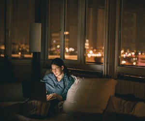 Woman using laptop at home