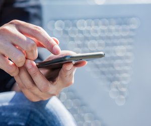 Hands of Woman Using Smart Phone