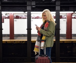 Woman in waiting for the train in the city