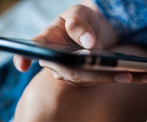 A woman is using a mobile phone