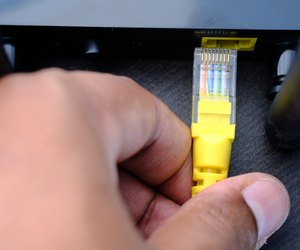 wireless router and cable on table