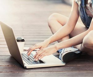 Girl using a laptop outdoors