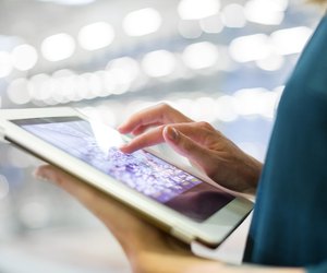 Businesswoman using digital tablet in office