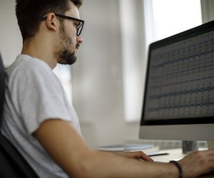 Young man working in his office