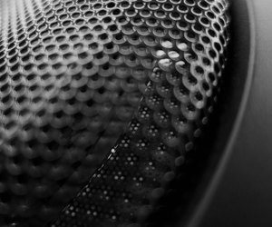 Abstract black metal speaker grid front