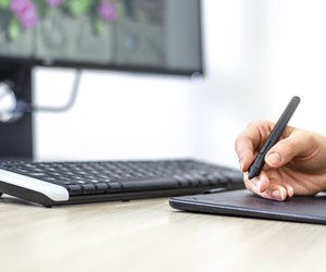 Female digital artist working at the office