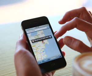 Woman Using Google Maps On Her iPhone