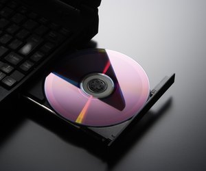 Inserting a CD into a laptop computer with copy space