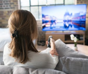 Woman watching tv at home