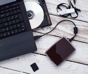 Laptop with pendrive, sd card, CD and portable hard drive.