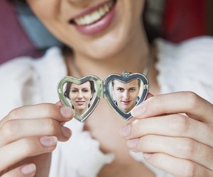 woman showing her boyfriend in locket