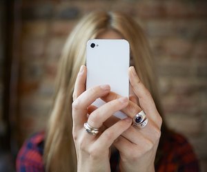 woman taking selfie with cell phone