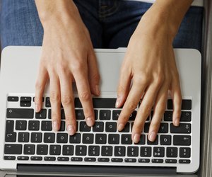 Woman typing on laptop