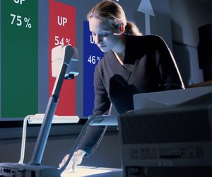 Businesswoman using overhead projector