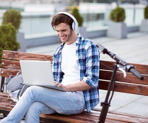 Cheerful man sitting on the bench