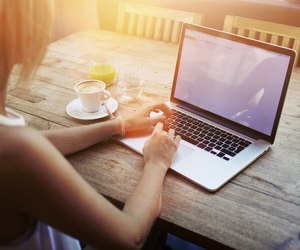 Female student working on net-book after her lectures in University