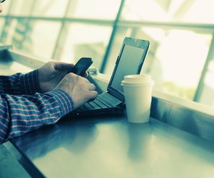 man's hands with tablet