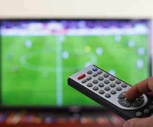 Televesion remote control in the hand, zapping
