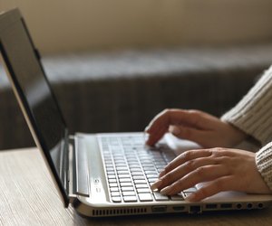 Woman hands working on keyboard